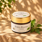 AyurPuran Surya Raksha Creme jar in dappled sunlight with tulsi leaves